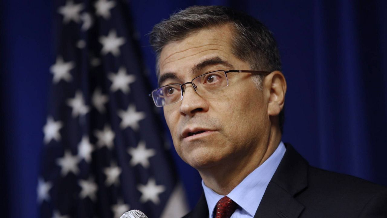 In this Dec. 4, 2019 photo, California Attorney General Xavier Becerra speaks during a news conference in Sacramento, Calif. The California Senate voted Sunday to require the state's top prosecutor to investigate all police shootings that kill an unarmed civilian. (AP Photo/Rich Pedroncelli)