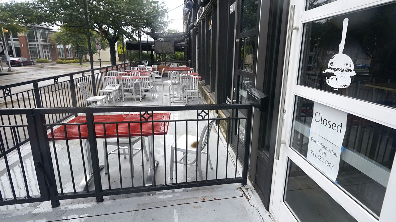 A closed burger eatery sits empty in Dallas, Wednesday, Sept. 2, 2020. (AP Photo/LM Otero)