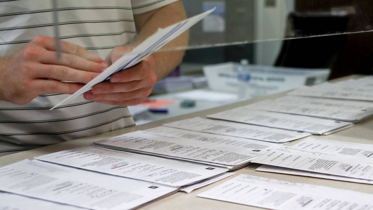 Mail-in ballots are processed during Pennsylvania’s primary election in May. (AP Photo/Keith Srakocic, File)