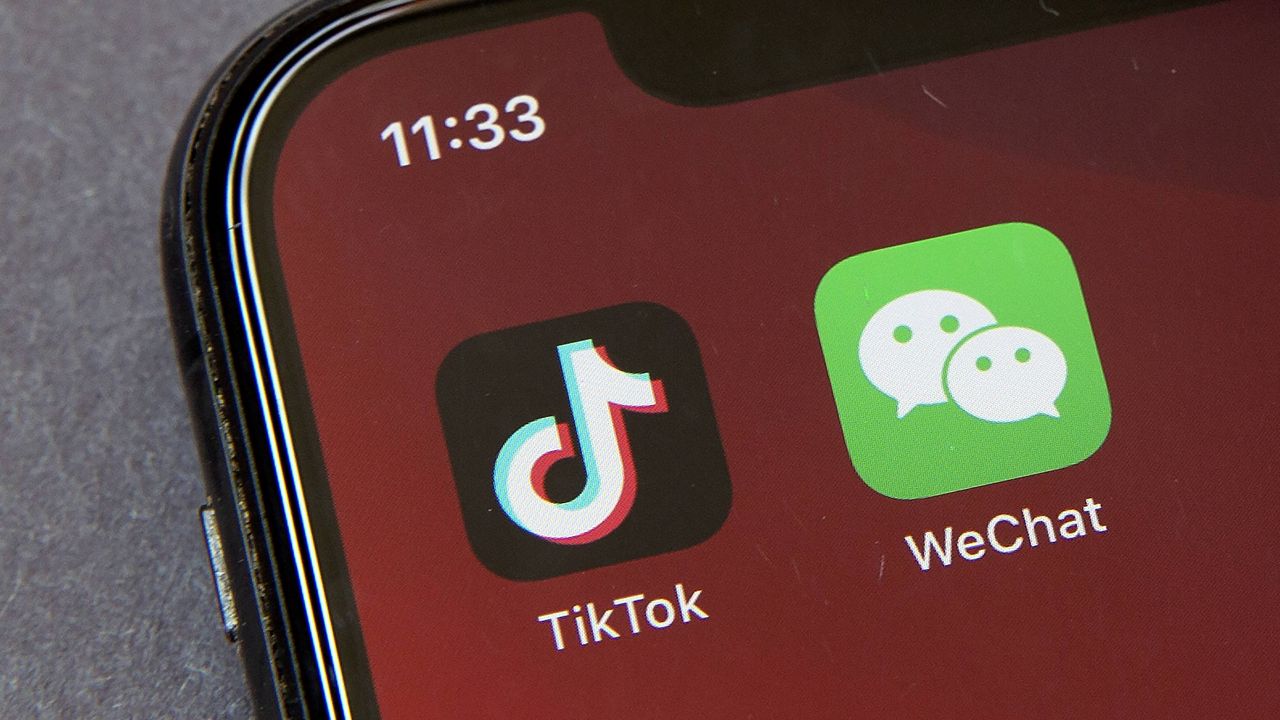 Icons for the smartphone apps TikTok and WeChat are seen on a smartphone screen. (AP Photo/Mark Schiefelbein, File)