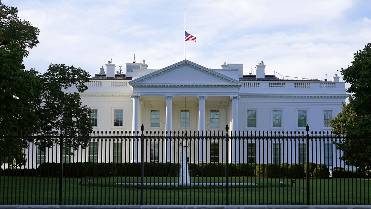 An American flag flies at half-staff over the White House in Washington, Saturday, Sept. 19, 2020. (AP Photo/Patrick Semansky)