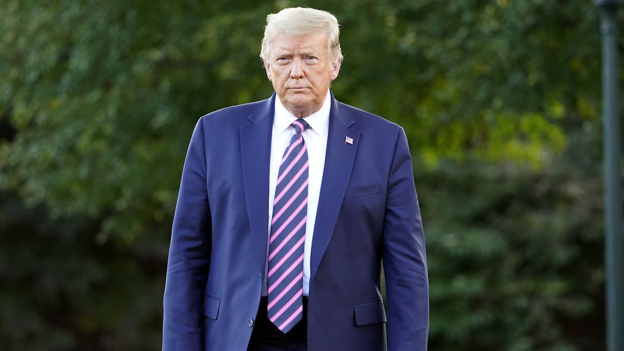 President Donald Trump walks toward reporters on the White House's South Lawn on Sept. 22. (AP Photo/Andrew Harnik)