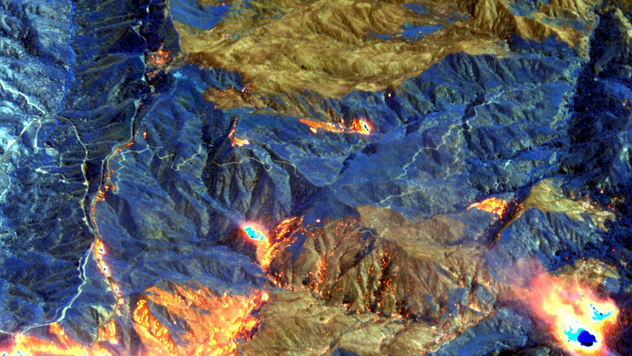 This Monday, Sept, 21, 2020, shortwave infrared satellite image provided by Maxar Technologies shows an area of the Bobcat Fire burning northeast of Los Angeles. (Maxar Technologies via AP)