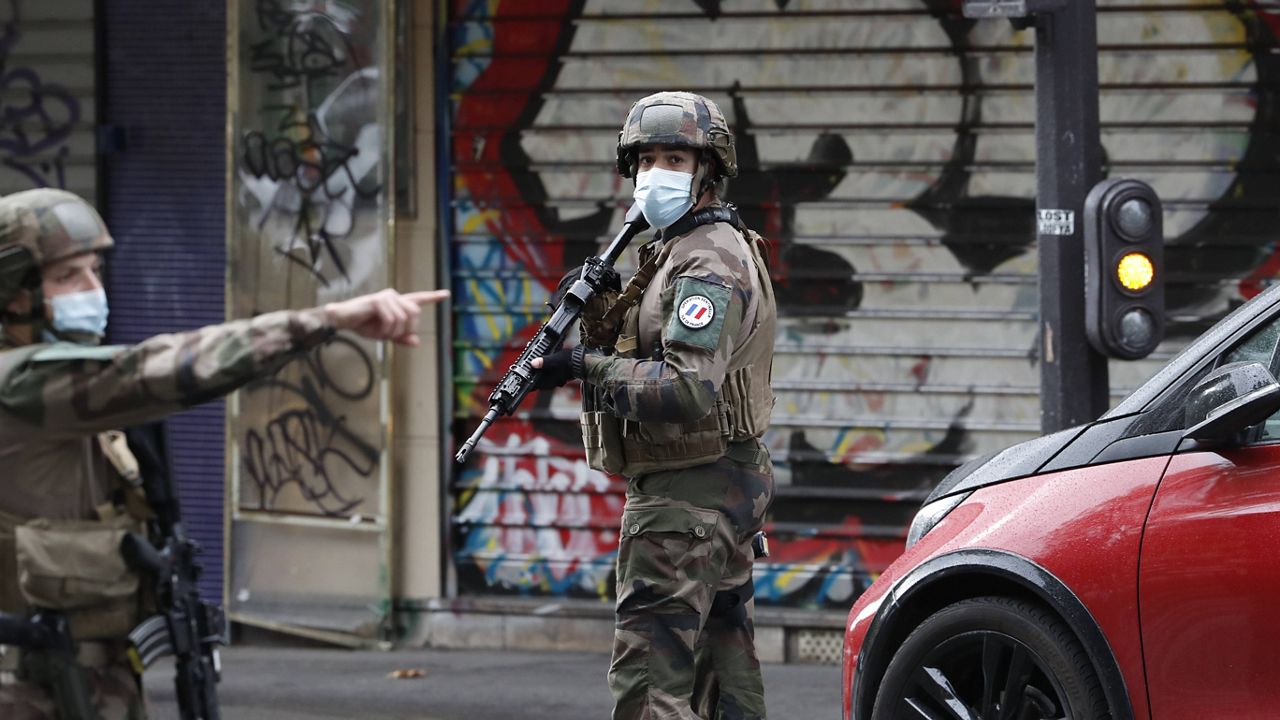 French soldiers patrol after four people were wounded in a knife attack in Paris. (AP Photo/Thibault Camus)