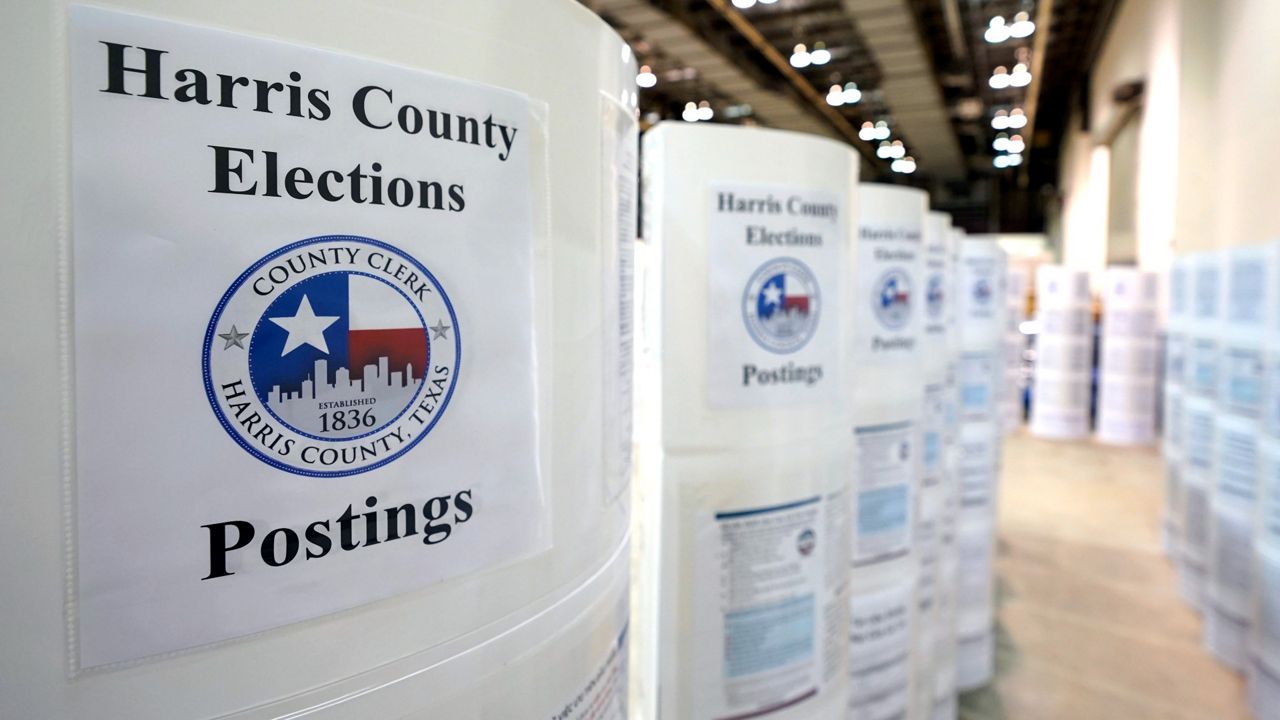 Signs that were posted at Harris County polling sites are lined up at election headquarters Tuesday, Sept. 29, 2020, in Houston. (AP Photo/David J. Phillip)