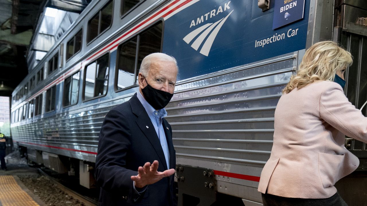 Democratic presidential candidate former Vice President Joe Biden and his wife Jill Biden board their train at Amtrak's Pittsburgh Train Station, Wednesday, Sept. 30, 2020, in Pittsburgh. (AP Photo/Andrew Harnik)
