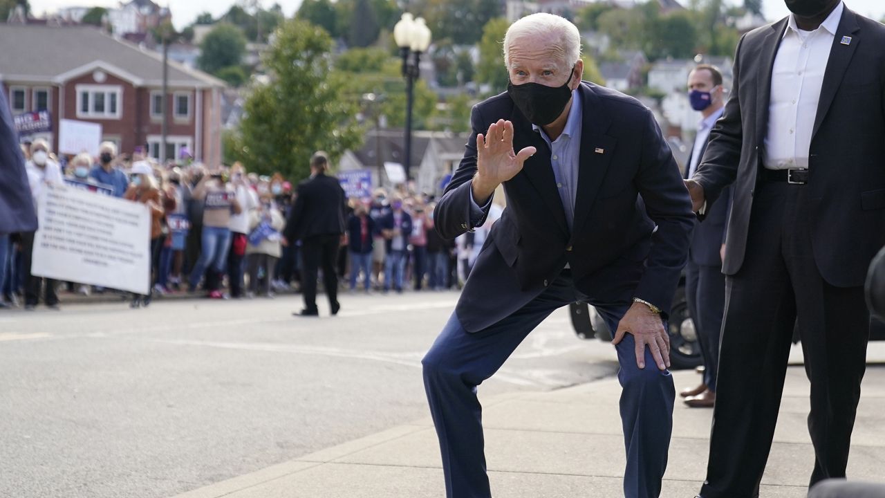 Democratic presidential candidate former Vice President Joe Biden waves to supporters outside the Amtrak's Greensburg Train Station, Wednesday, Sept. 30, 2020, in Greensburg, Pa. Biden is on a train tour through Ohio and Pennsylvania today. (AP Photo/Andrew Harnik)