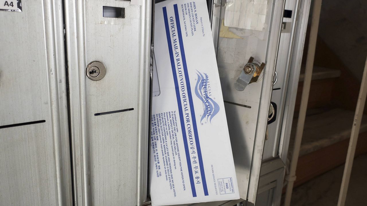 A mail-in ballot for the presidential election is positioned in the mailbox where it arrived in Rutherford, New Jersey, on Oct. 2, 2020. (AP Photo/Ted Shaffrey)