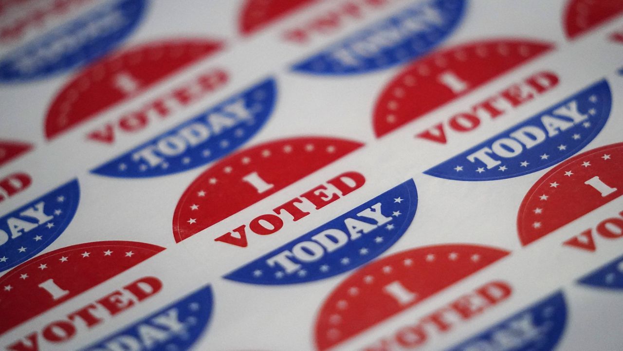 In this Sept. 29, 2020, file photo, stickers to be given to people who have voted are seen at a satellite election office at Temple University's Liacouras Center in Philadelphia. (AP Photo/Matt Slocum, File)