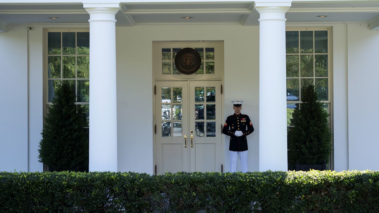 A Marine is posted outside the West Wing of the White House, signifying the President is in the Oval Office, Wednesday, Oct. 7, 2020, in Washington. (AP Photo/Evan Vucci)