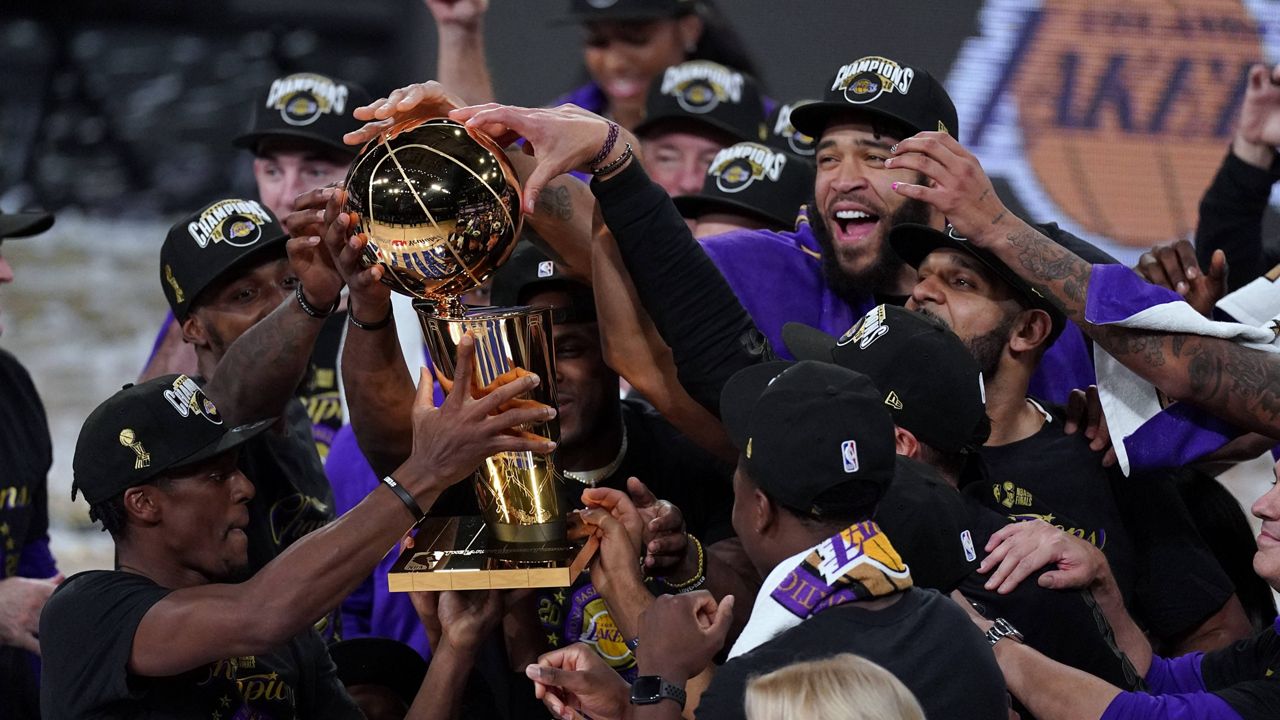 The Los Angeles Lakers celebrate after defeating the Miami Heat to win the NBA Finals on Sunday night. (AP Photo/Mark J. Terrill)