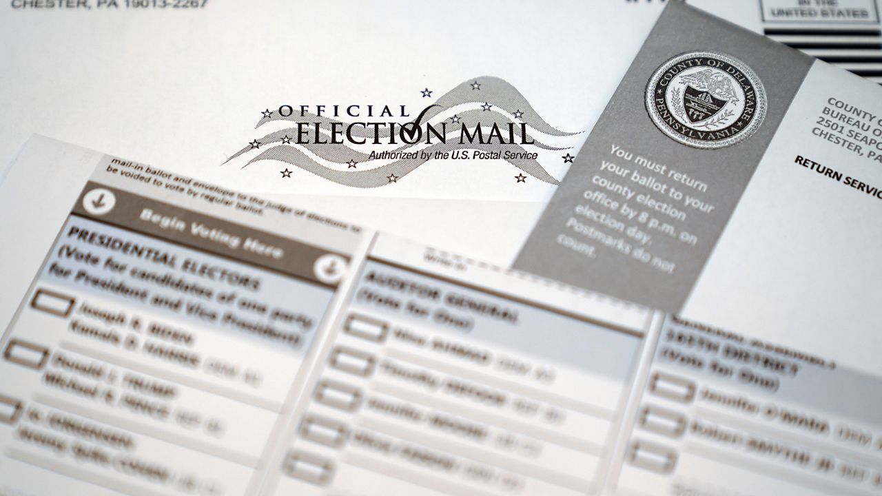 An official mail-in ballot for the 2020 General Election in the United States is shown, Tuesday, Oct. 13, 2020, in Marple Township, Pa. (AP Photo/Matt Slocum)