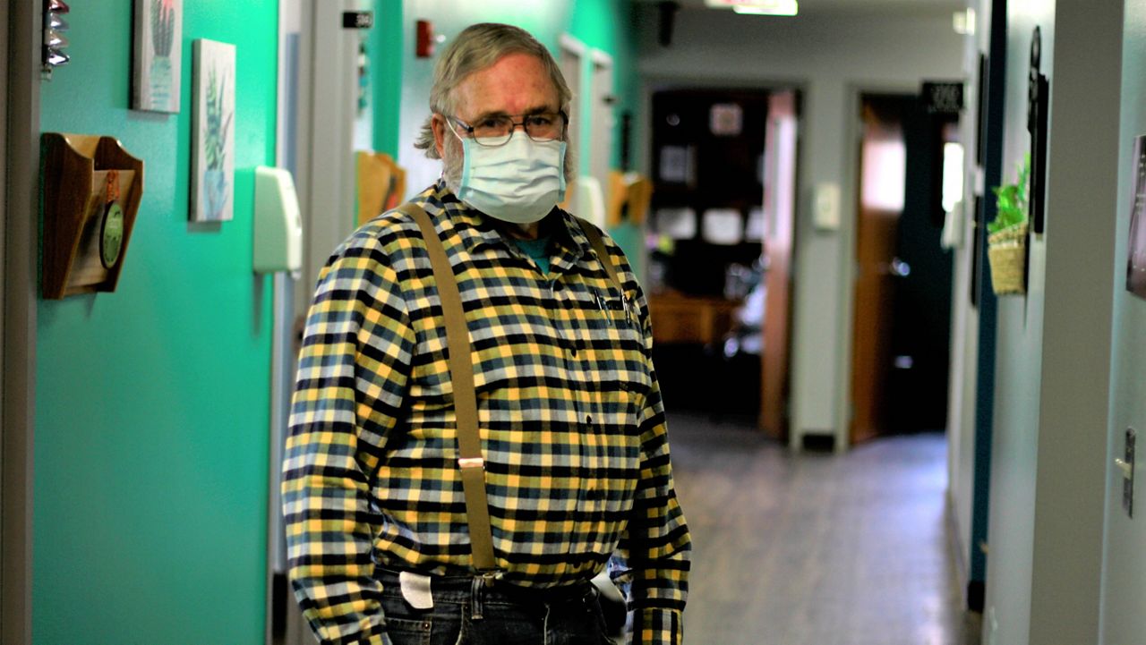 Dr. Tom Dean poses at his clinic in Wessington Springs, S.D., on Friday. Oct. 16, 2020. (AP Photo/Stephen Groves)