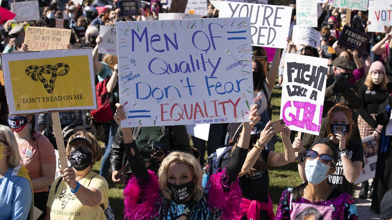 Protestors rally during the Women's March at Freedom Plaza on Saturday in Washington. (AP Photo/Jose Luis Magana)