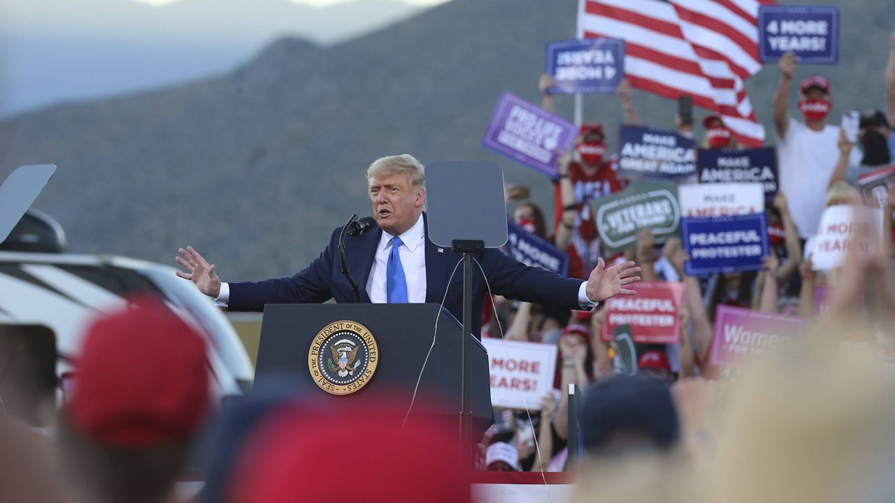 President Donald Trump speaks at a campaign rally at Carson City Airport in Carson City, Nev., on Sunday. (AP Photo/Lance Iversen)