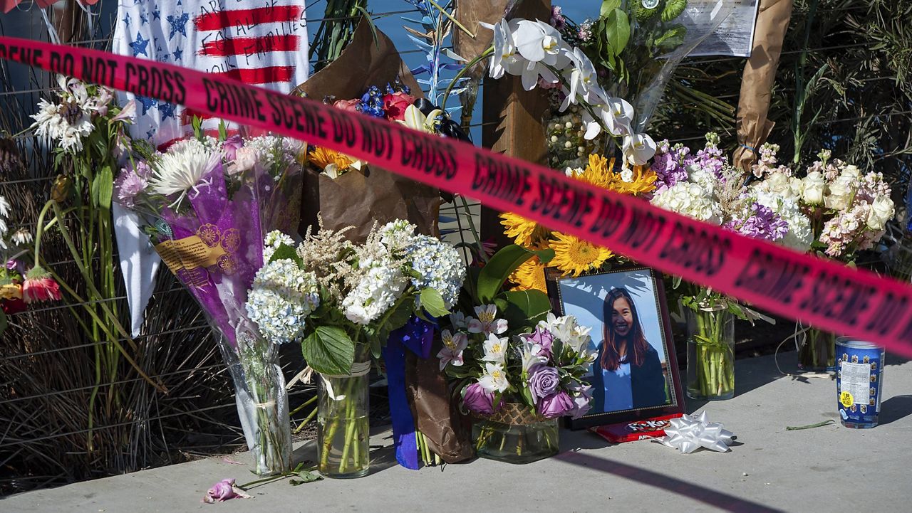 Red crime scene tape blocks off a memorial for the victims of the Conception dive boat fire on the Santa Barbara Harbor, as authorities issue a search warrant for the Truth Aquatics' offices on the Santa Barbara Harbor in Santa Barbara, Calif on Sept. 8, 2019. (AP Photo/ Christian Monterrosa, File)