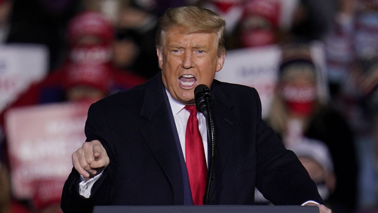 President Donald Trump speaks during a campaign rally Tuesday night at Erie International Airport in Erie, Pa. (AP Photo/Gene J. Puskar)