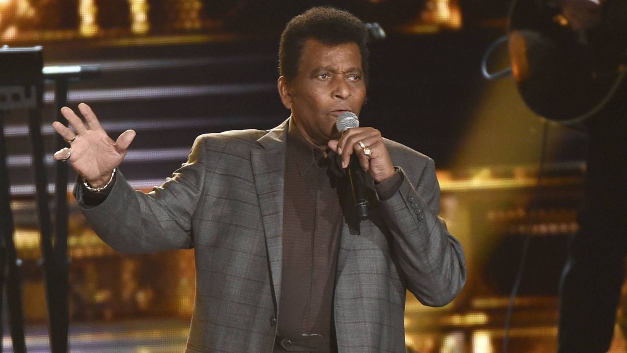 FILE - Charley Pride performs "Kiss An Angel Good Morning" at the 50th annual CMA Awards in Nashville, Tenn. on Nov. 3, 2016. (Charles Sykes/Invision/AP)