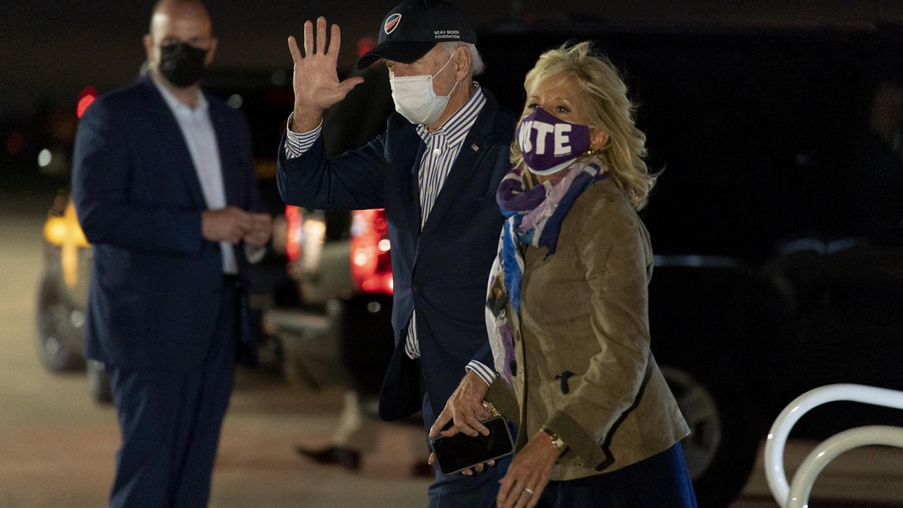 Democratic presidential candidate former Vice President Joe Biden and his wife Jill Biden arrive at New Castle Airport in New Castle, Del., Saturday, Oct. 24, 2020, after holding drive-in rallies in Bristol, Pa., and Dallas, Pa. (AP Photo/Andrew Harnik)