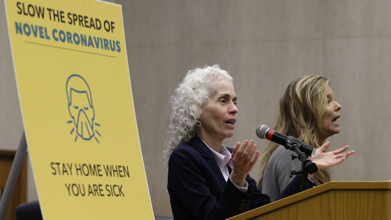 Los Angeles County Public Health Director Barbara Ferrer, left, takes questions at a news conference in Los Angeles on March 12, 2020. (AP Photo/Damian Dovarganes, File)