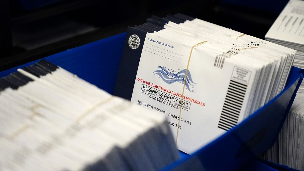 FILE PHOTO of mail-in ballots. (AP Photo/Matt Slocum, File)