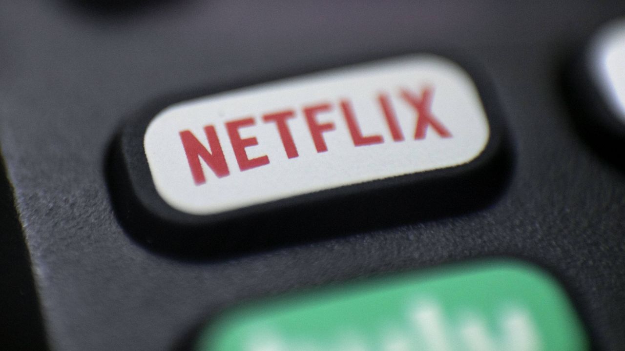 This Aug. 13, 2020 file photo shows a logo for Netflix on a remote control in Portland, Ore. (AP Photo/Jenny Kane, File)