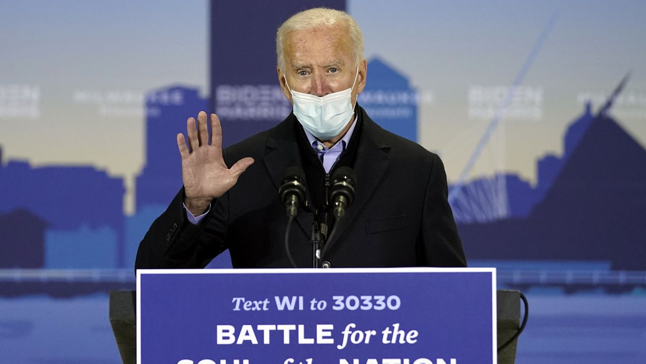 Democratic presidential candidate former Vice President Joe Biden speaks in a hanger at General Mitchell International Airport, Friday, Oct. 30, 2020, in Milwaukee. (AP Photo/Andrew Harnik)