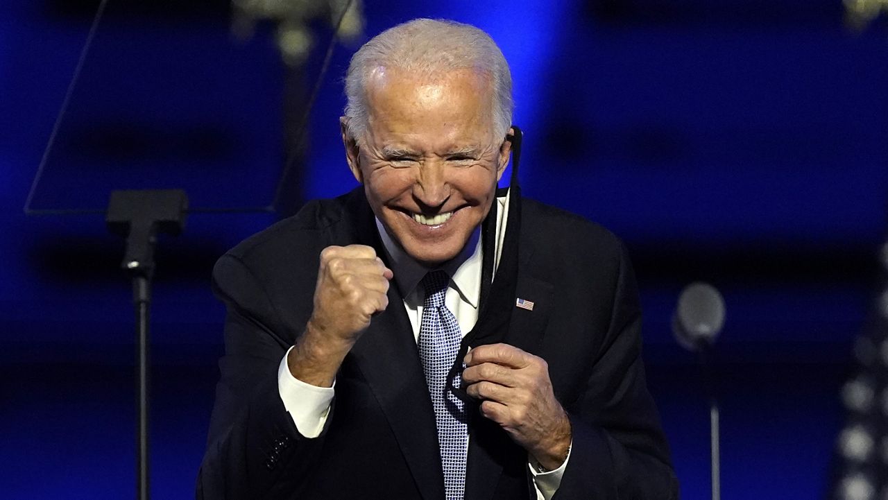 President-elect Joe Biden gestures to supporters Saturday, Nov. 7, 2020, in Wilmington, Del. (AP Photo/Andrew Harnik)