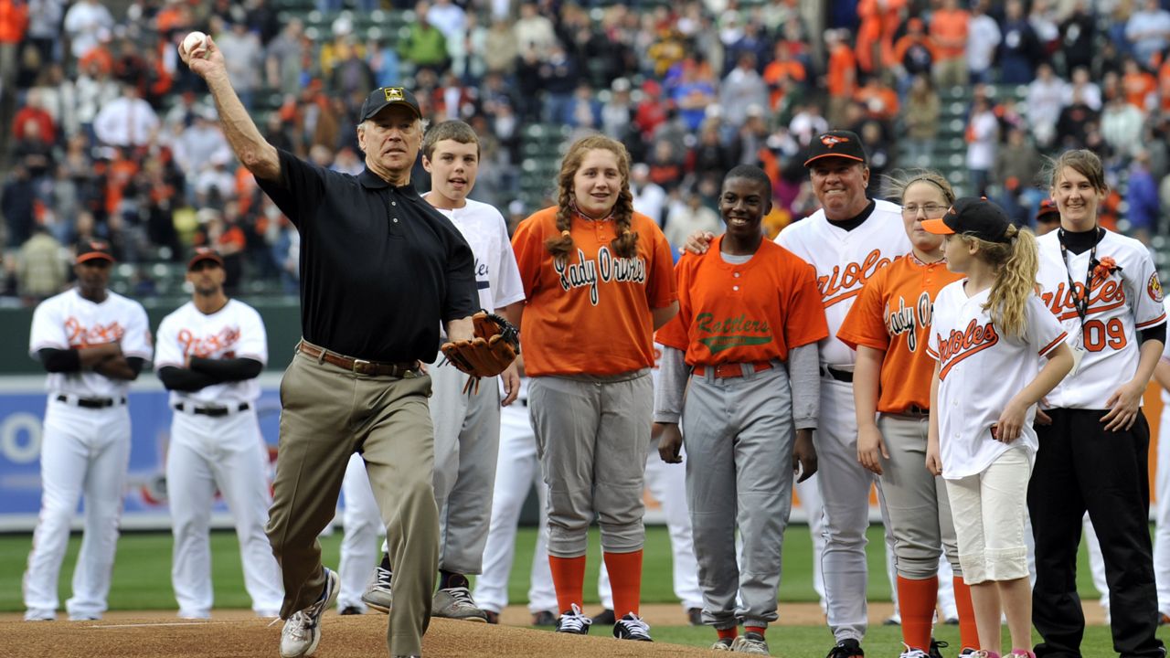 FILE - In this April 6, 2009, file photo, Vice President Joe Biden throws out the first pitch prior to the Baltimore Orioles and the New York Yankees opening day baseball game at Camden Yards in Baltimore. (AP Photo/Gail Burton, File)