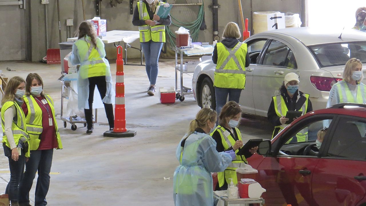 This 2020 photo provided by Carlton County shows their drive-thru flu clinic in Carlton, Minn. The facility is a way to social distance in the coronavirus pandemic, but also served as a test run for the COVID-19 vaccines that county health officials still know little about. (Jared Hovi/Carlton County GIS via AP)