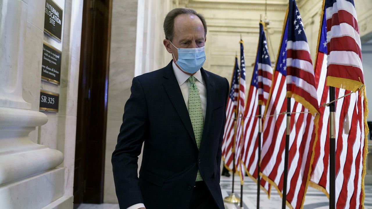 Sen. Pat Toomey, R-Pa., departs after the Republican Conference held leadership elections, on Capitol Hill in Washington, Tuesday, Nov. 10, 2020. (AP Photo/J. Scott Applewhite)