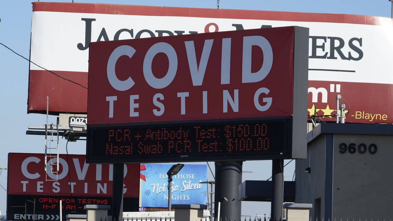 Advertisements for COVID-19 testing areas posted outside Los Angeles International Airport, Friday, Nov. 13, 2020. (AP/Damian Dovarganes)