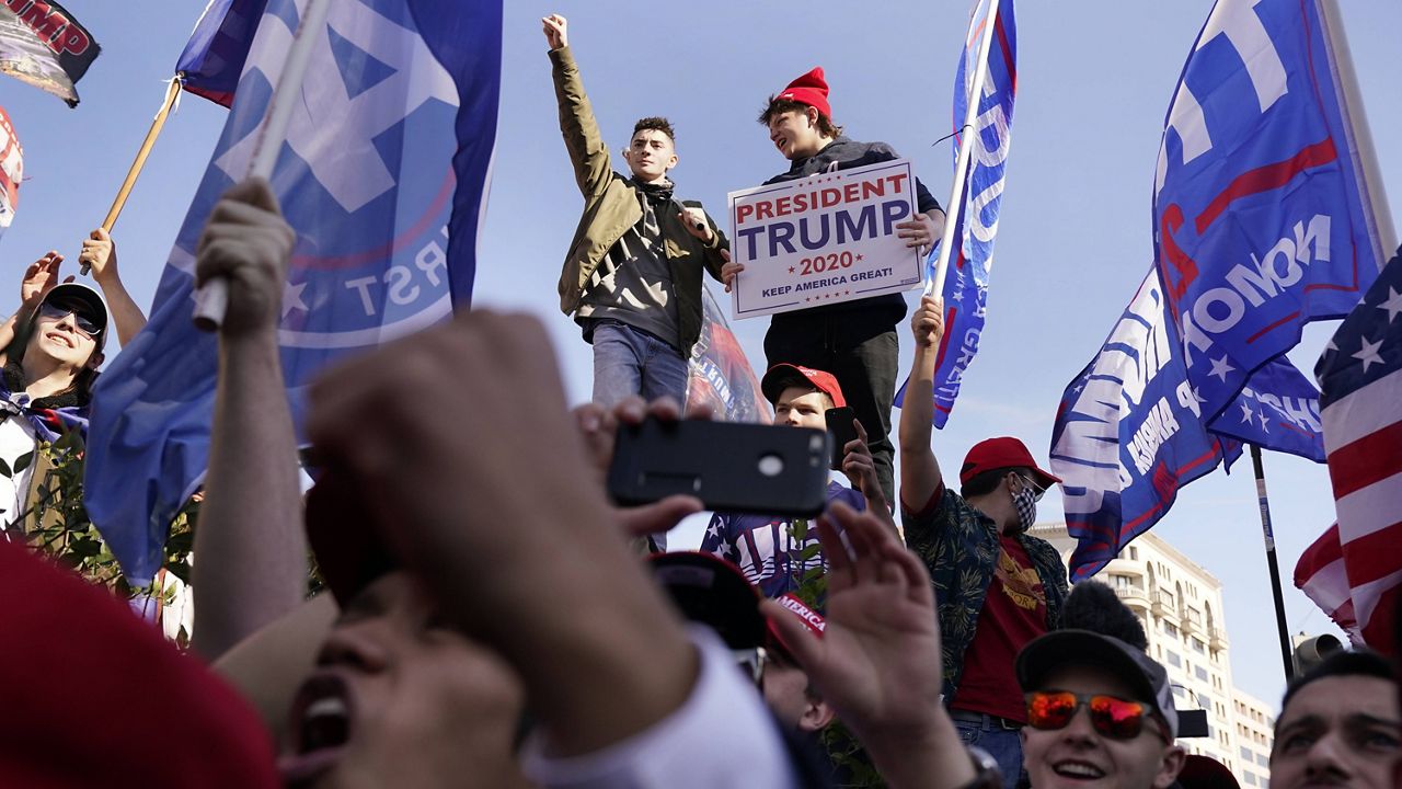 Supporters of President Donald Trump attend a pro-Trump march Saturday Nov. 14, 2020, in Washington. (AP Photo/Jacquelyn Martin)