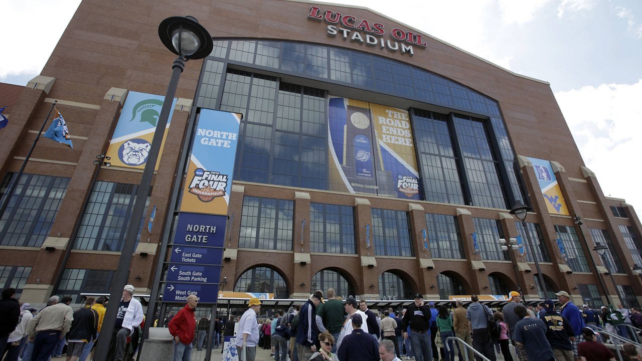 Fans arrive at Lucas Oil Stadium before a men's NCAA Final Four game in 2010. (AP Photo/Amy Sancetta, File)