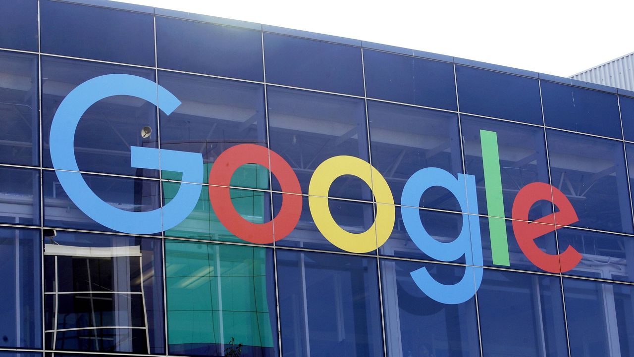 In this Sept. 24, 2019, file photo a sign is shown on a Google building at their campus in Mountain View, Calif. (AP Photo/Jeff Chiu, FILE)