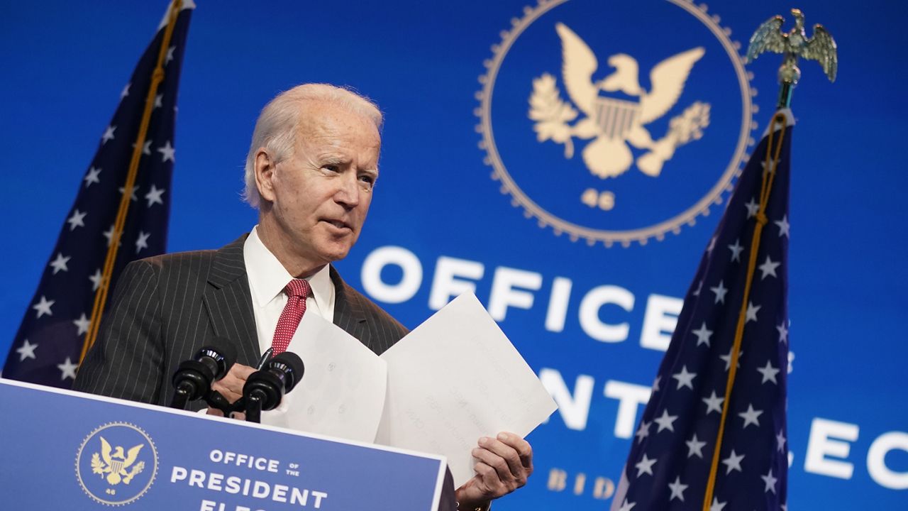 President-elect Joe Biden, accompanied by Vice President-elect Kamala Harris, speaks at The Queen theater, Thursday, Nov. 19, 2020, in Wilmington, Del. (AP Photo/Andrew Harnik)