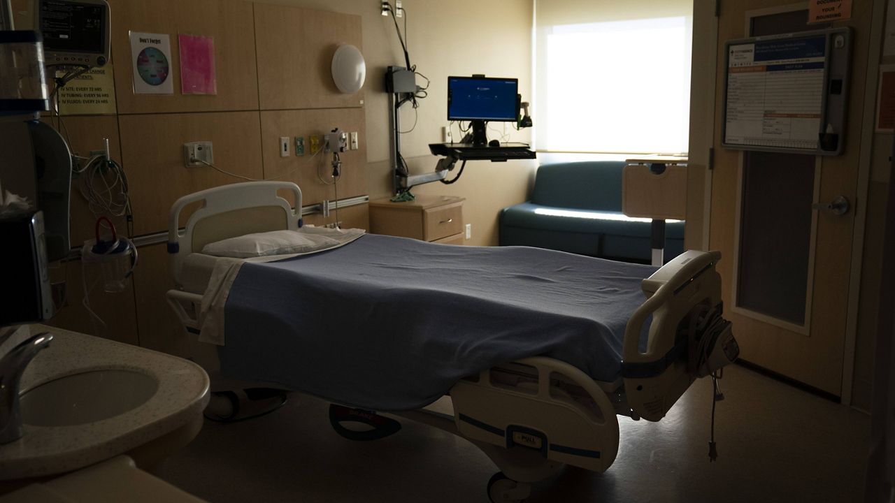 An unoccupied hospital bed is seen in a COVID-19 unit at Providence Holy Cross Medical Center in the Mission Hills section of Los Angeles, Thursday, Nov. 19, 2020. (AP Photo/Jae C. Hong)