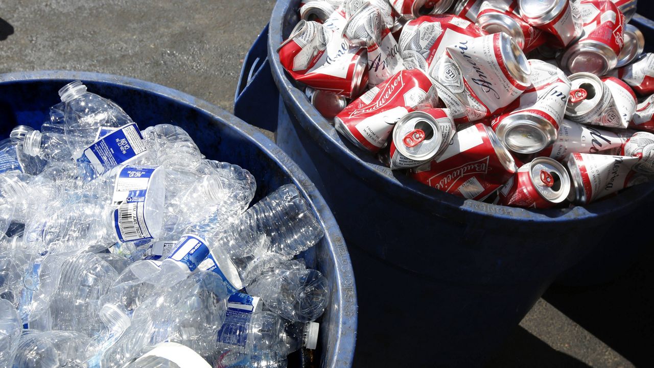 In this July 5, 2016, file photo, cans and plastic bottles brought in for recycling fill containers at a recycling center in Sacramento, Calif. (AP Photo/Rich Pedroncelli, File)