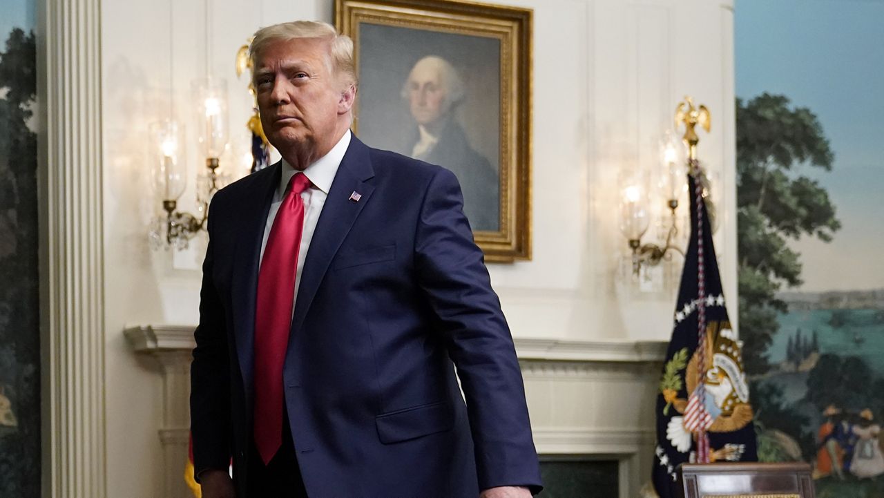 President Donald Trump departs after participating in a video teleconference call with members of the military on Thanksgiving, Thursday, Nov. 26, 2020, at the White House in Washington. (AP Photo/Patrick Semansky)