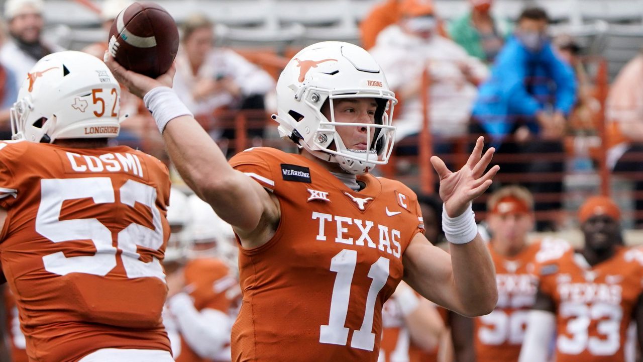 Texas quarterback Sam Ehlinger (11) is stopped by Oklahoma State