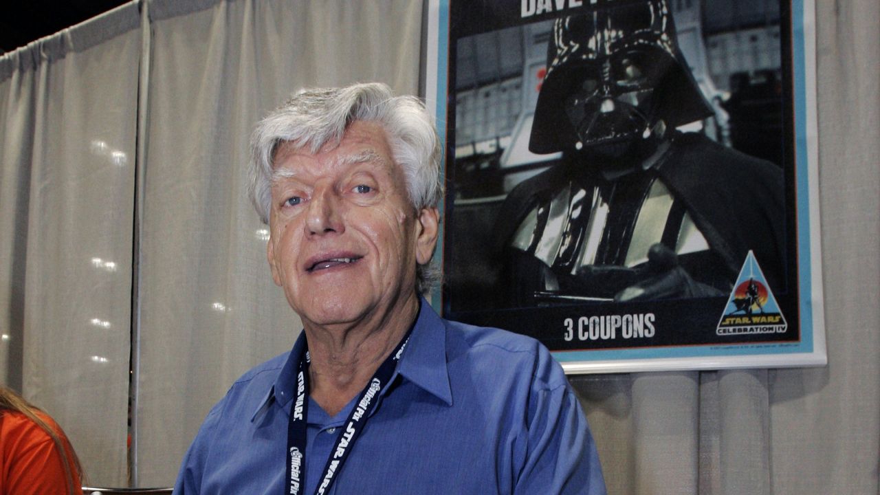 FILE - In this file photo dated Saturday, May 26, 2007, actor David Prowse, who was the man in the black Darth Vader suit in the first Star Wars film, signs autographs at Star Wars Celebration IV, marking the 30th anniversary of the release of the first film in the Star Wars saga, in Los Angeles, USA. (AP Photo/Reed Saxon, FILE)