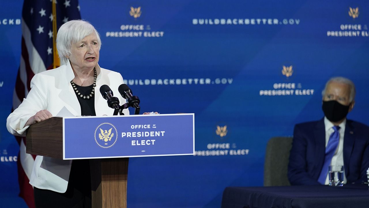 President-elect Joe Biden, right, listens as Janet Yellen, who Biden nominated to serve as Secretary of the Treasury, speaks at The Queen theater, Tuesday, Dec. 1, 2020, in Wilmington, Del. (AP Photo/Andrew Harnik)