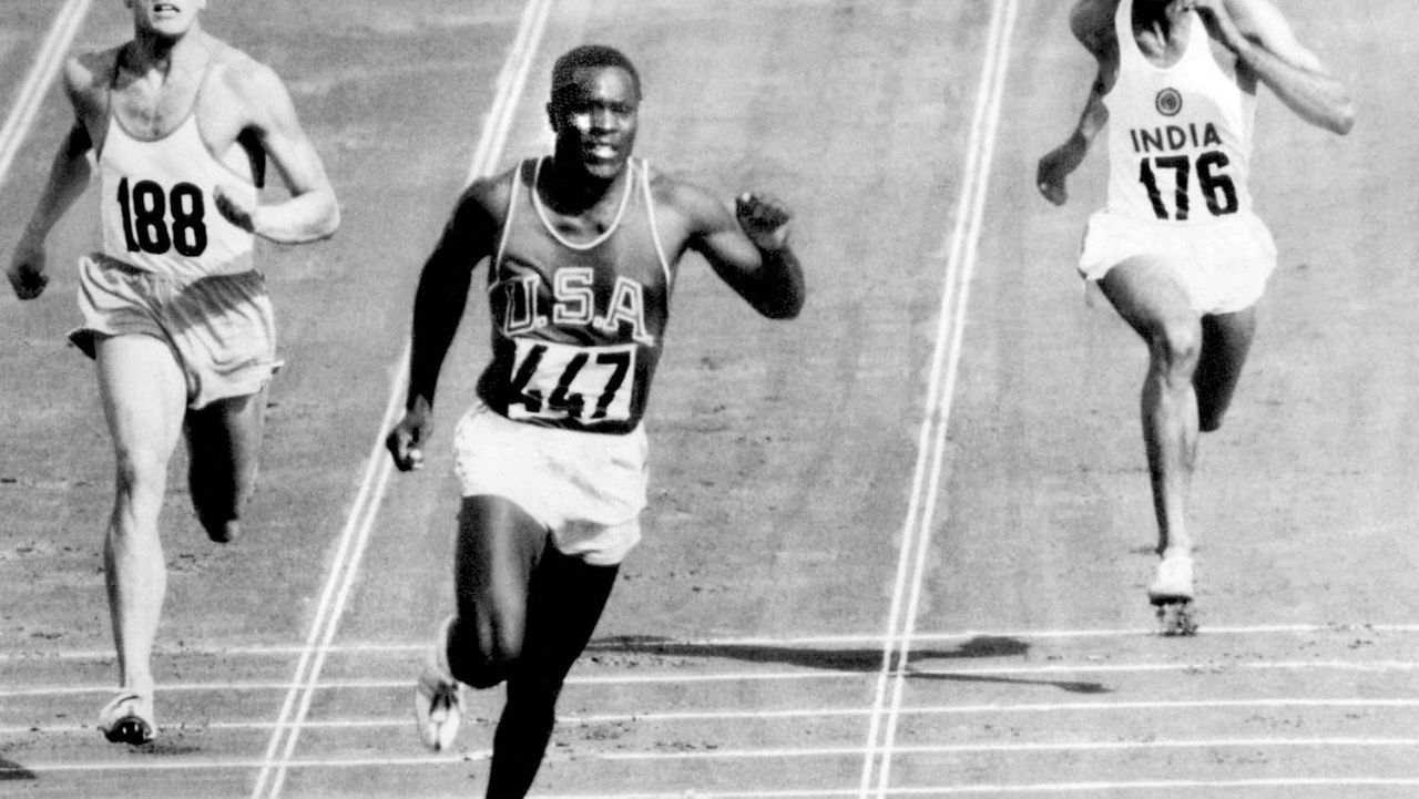 FILE - In this Sept. 5, 1960, file photo, Rafer Johnson of the United States, center, finishers the fourth heat of the decathlon 100 meter dash at the Olympics in Rome, Italy. (AP Photo/Olympic Pool, File)
