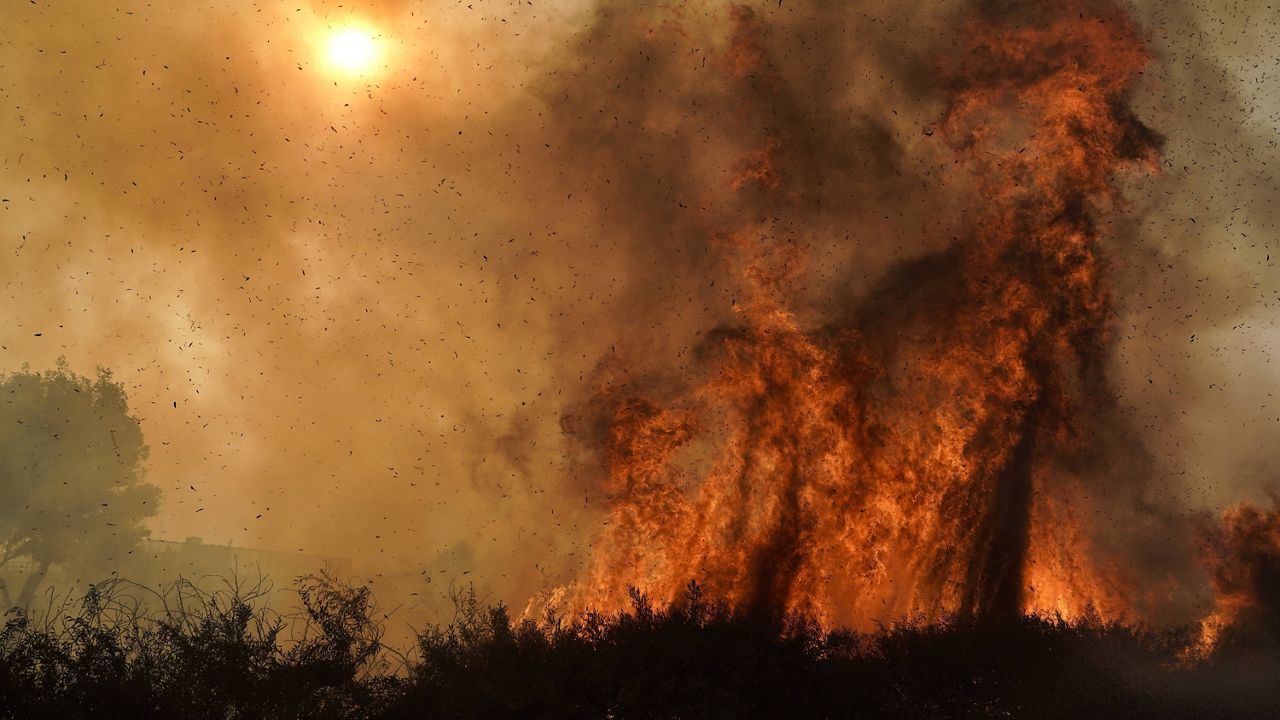 The Silverado Fire burns along the 241 State Highway in Irvine, Calif. on Oct. 26, 2020. (AP Photo/Jae C. Hong, File)