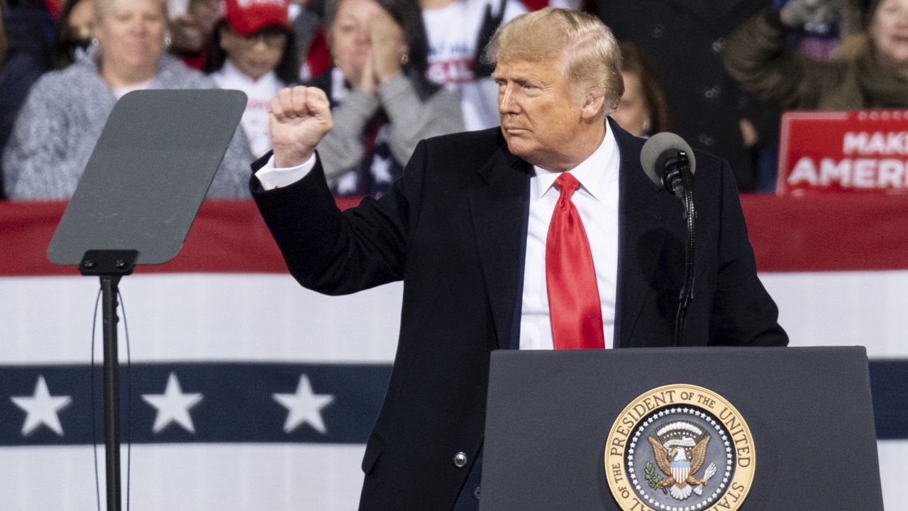 President Donald Trump addresses the crowd at a rally for U.S. Senators Kelly Loeffler, R-Ga., and David Perdue, R-Ga., who are both facing runoff elections Saturday, Dec. 5, 2020, in Valdosta, Ga. (AP Photo/Ben Gray)