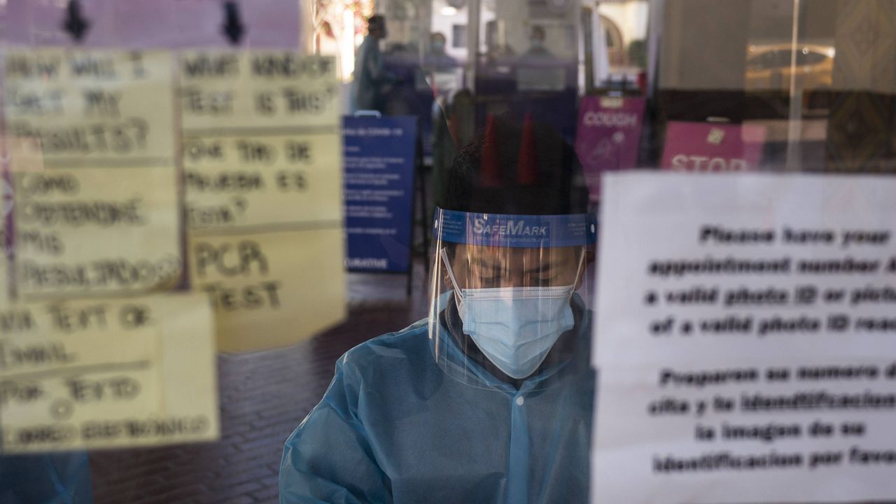 Test specialist Lester Gopar works at a COVID-19 testing site in Los Angeles, Wednesday, Dec. 9, 2020. (AP Photo/Jae C. Hong)