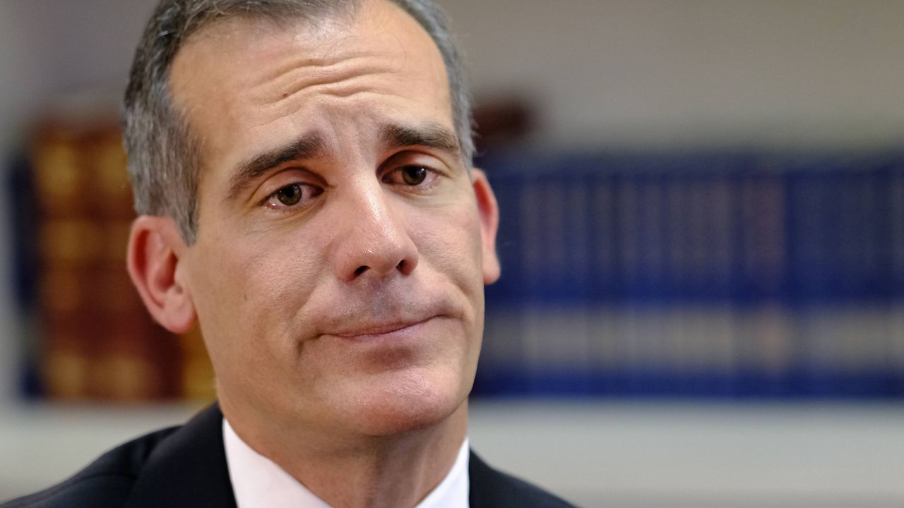 In this Aug. 16, 2018 file photo, Los Angeles Mayor Eric Garcetti is interviewed by the Associated Press in Los Angeles. Garcetti has taken his name out of consideration for a possible post in the Biden administration. (AP Photo/Richard Vogel FIle)