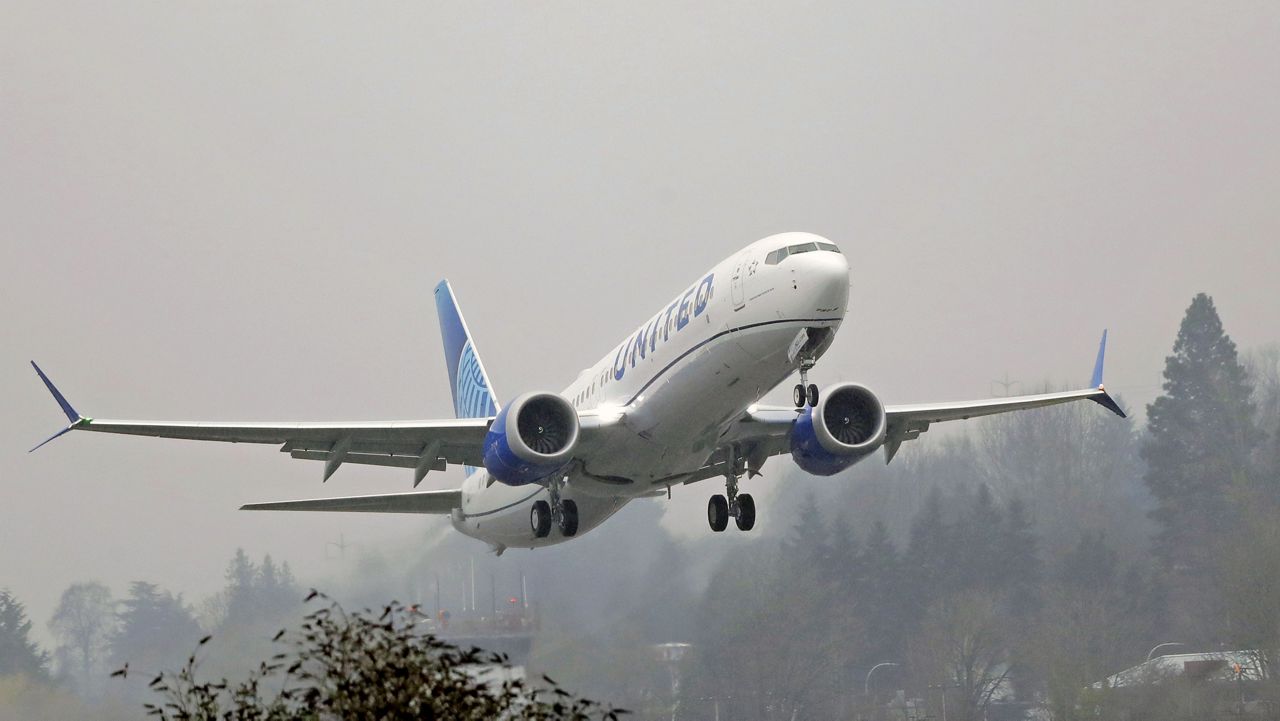 FILE - In this Wednesday, Dec. 11, 2019 file photo, a United Airlines Boeing 737 Max airplane takes off in the rain at Renton Municipal Airport in Renton, Wash. (AP Photo/Ted S. Warren, File)