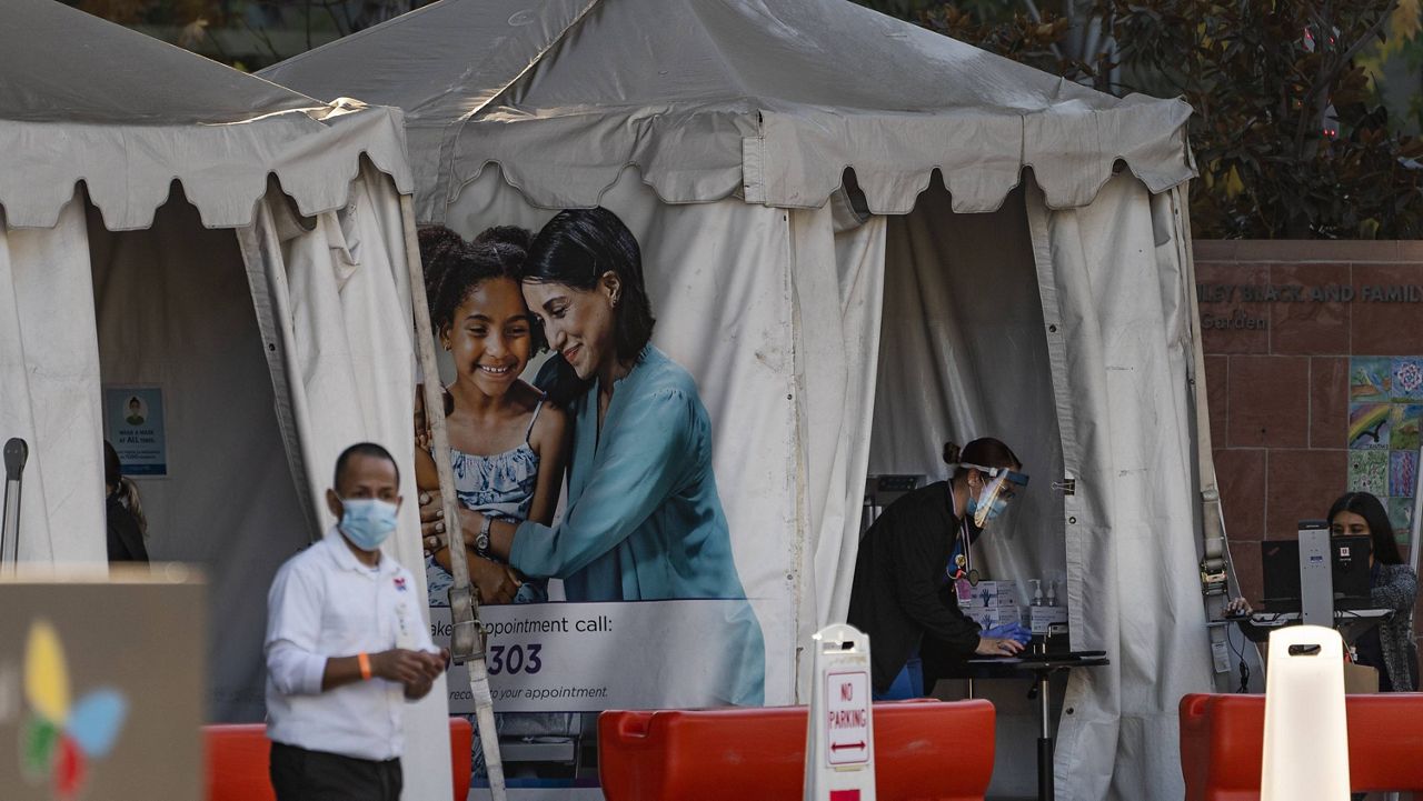 Medical tents for vaccinations are set outside the Children's Hospital Los Angeles Friday, Dec. 18, 2020. (AP Photo/Damian Dovarganes)
