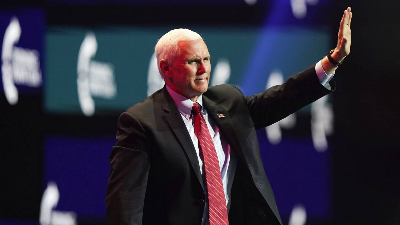 Vice President Mike Pence waves as he walks off the stage after speaking at the Turning Point USA Student Action Summit, Dec. 22, 2020, in West Palm Beach, Fla. (AP/Lynne Sladky)